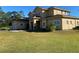 Expansive two-story home featuring a well-manicured lawn and attached two-car garage at 20526 Quinella St, Orlando, FL 32833