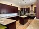Modern kitchen features stainless steel appliances, granite countertops, and a central island at 20526 Quinella St, Orlando, FL 32833