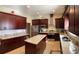 Modern kitchen with stainless steel appliances, center island, and granite countertops at 20526 Quinella St, Orlando, FL 32833
