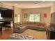 Inviting living room with a large, comfortable sectional sofa and stylish rug at 20526 Quinella St, Orlando, FL 32833