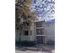 Exterior view of condo building with parking and landscaping at 3028 Parkway Blvd # 210, Kissimmee, FL 34747