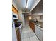 View of kitchen with granite countertops and appliances at 3028 Parkway Blvd # 210, Kissimmee, FL 34747