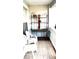 Balcony with an vintage shelf set and white chairs at 101 Whitehall Way, Kissimmee, FL 34758