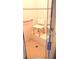 Accessible bathroom showcasing a tiled shower equipped with a safety seat and grab bar at 101 Whitehall Way, Kissimmee, FL 34758