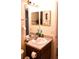 Cozy bathroom featuring a granite countertop vanity and a mirrored wall cabinet at 101 Whitehall Way, Kissimmee, FL 34758