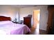 Well-organized bedroom with ample storage, a full-size bed, and a view to the ensuite at 101 Whitehall Way, Kissimmee, FL 34758