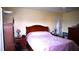 Comfortable bedroom featuring wood furnishings and a soft, inviting bedspread at 101 Whitehall Way, Kissimmee, FL 34758