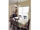 Well-lit dining room with seating for six at 101 Whitehall Way, Kissimmee, FL 34758