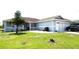 Single-story house featuring well-maintained lawn, covered porch, and attached garage at 101 Whitehall Way, Kissimmee, FL 34758