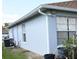 The property's side view showcases its clean lines and exterior finishes at 101 Whitehall Way, Kissimmee, FL 34758