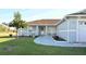 Charming single-story home featuring a covered front porch, well-manicured lawn, and inviting curb appeal at 101 Whitehall Way, Kissimmee, FL 34758