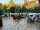 Beautiful outdoor space featuring a covered seating area, patio dining set, and a fire pit at 2606 Royal Fern Pl, Kissimmee, FL 34758