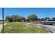 Basketball court with a pavilion and parking spaces in a green outdoor area providing residents a space for sports and recreation at 2606 Royal Fern Pl, Kissimmee, FL 34758