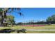 Community basketball court and pavilion in a green outdoor area providing residents a space for sports and recreation at 2606 Royal Fern Pl, Kissimmee, FL 34758