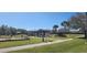 Palm Park community area showcasing a playground and gazebo surrounded by well-maintained green spaces at 2606 Royal Fern Pl, Kissimmee, FL 34758
