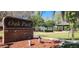 Sign for Oak Park, surrounded by walking paths, pavilions, and lush greenery offering a community gathering space at 2606 Royal Fern Pl, Kissimmee, FL 34758