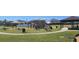 Community playground with picnic tables, shaded seating areas, and climbing structures offering a fun outdoor space at 2606 Royal Fern Pl, Kissimmee, FL 34758