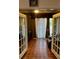 Enclosed sun room with vintage tile floor and French doors at 2606 Royal Fern Pl, Kissimmee, FL 34758