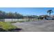 Well-maintained community tennis court providing a venue for recreational play with parking spaces at 2606 Royal Fern Pl, Kissimmee, FL 34758