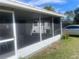 View of the enclosed screened patio, perfect for relaxing outdoors bug-free at 7024 Moderna Way, Orlando, FL 32822