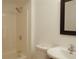Simple bathroom with shower, toilet, and sink at 8846 Coral Palms Ct # A, Kissimmee, FL 34747