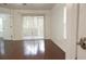 Hardwood floor bedroom with sliding glass doors leading to a balcony at 8846 Coral Palms Ct # A, Kissimmee, FL 34747