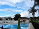 Inviting community pool with lounge chairs and patio area at 8846 Coral Palms Ct # A, Kissimmee, FL 34747