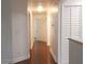 Clean hallway with wood flooring and white walls at 8846 Coral Palms Ct # A, Kissimmee, FL 34747