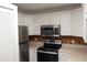 Modern kitchen featuring stainless steel appliances at 8846 Coral Palms Ct # A, Kissimmee, FL 34747