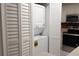 Convenient laundry closet with stacked washer and dryer at 8846 Coral Palms Ct # A, Kissimmee, FL 34747