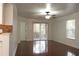 Bright and airy living room with hardwood floors and access to a balcony at 8846 Coral Palms Ct # A, Kissimmee, FL 34747