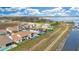 Aerial view of neighborhood homes and waterfront property with a lake view at 13809 Abberwick Dr, Orlando, FL 32832