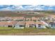 Aerial view of neighborhood homes with private pools and well-maintained lawns at 13809 Abberwick Dr, Orlando, FL 32832