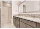 Bathroom with granite countertops, a double vanity, and a shower with curtain at 13809 Abberwick Dr, Orlando, FL 32832