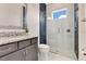 Modern bathroom with a glass-enclosed shower, granite countertop and vessel sink at 13809 Abberwick Dr, Orlando, FL 32832