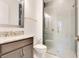 Bathroom with granite countertops, vanity, and a glass-enclosed shower at 13809 Abberwick Dr, Orlando, FL 32832