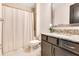 Bathroom features granite countertops, a vanity, and a shower with a curtain at 13809 Abberwick Dr, Orlando, FL 32832