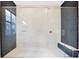 Modern bathroom with a glass-enclosed shower and dark blue subway tile at 13809 Abberwick Dr, Orlando, FL 32832