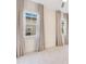 Bedroom featuring two windows with curtains and neutral colored walls at 13809 Abberwick Dr, Orlando, FL 32832
