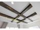 Unique coffered ceiling design with wood beams and recessed lighting, adding character to the room at 13809 Abberwick Dr, Orlando, FL 32832