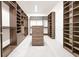Large walk-in closet with custom shelving and storage solutions for organization and convenience at 13809 Abberwick Dr, Orlando, FL 32832