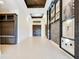 Spacious foyer featuring a dark wood double-door, custom art displays, and modern recessed lighting at 13809 Abberwick Dr, Orlando, FL 32832