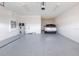 Spacious garage with epoxy flooring, providing ample parking and storage space at 13809 Abberwick Dr, Orlando, FL 32832