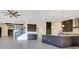 Spacious open-concept layout with a view of the staircase and a large kitchen island with granite countertops at 13809 Abberwick Dr, Orlando, FL 32832