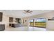 Open kitchen with a large island, pendant lighting and access to an outdoor patio at 13809 Abberwick Dr, Orlando, FL 32832