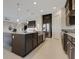 Kitchen island with granite countertops, sink, and stainless steel appliances creates a modern and functional space at 13809 Abberwick Dr, Orlando, FL 32832
