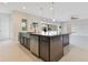 Bright, open kitchen with a large island, stainless steel appliances, and a view to the outside at 13809 Abberwick Dr, Orlando, FL 32832
