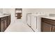 Well-equipped laundry room with granite counters and a washer and dryer at 13809 Abberwick Dr, Orlando, FL 32832