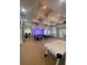 An airy game room has pool tables, arcade games, and a ping pong table for residents at 8910 Legacy Ct # 206, Kissimmee, FL 34747