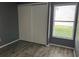 Bedroom features wood-look floors, a large closet and a large window to the outside at 98 Pine Island Cir, Kissimmee, FL 34743